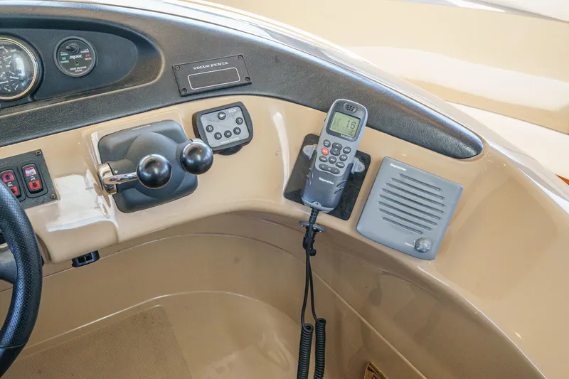  Yacht Photos Pics 2003 Carver 570 Voyager Pilothouse helm with controls and communication equipment.