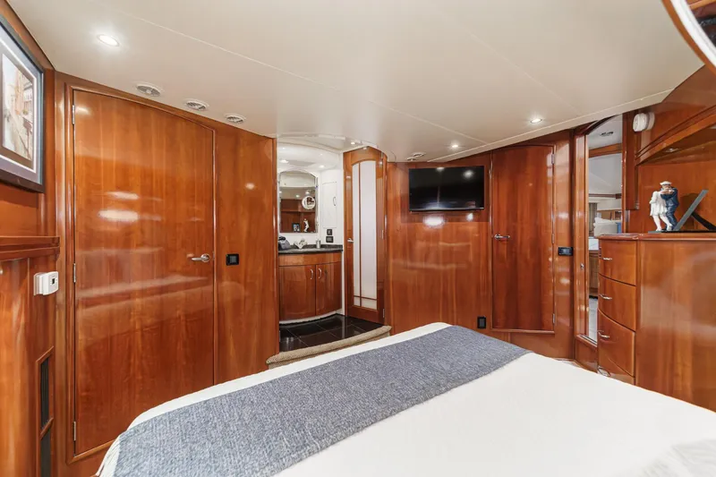  Yacht Photos Pics Luxurious interior of 2003 Carver 570 Voyager Pilothouse with wood paneling and modern amenities.