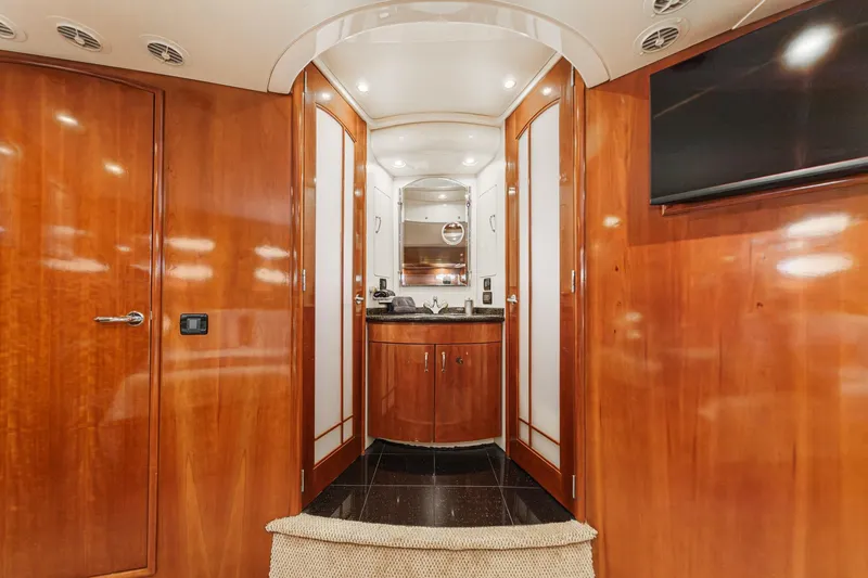  Yacht Photos Pics Luxurious interior of 2003 Carver 570 Voyager Pilothouse with wood paneling and modern amenities.