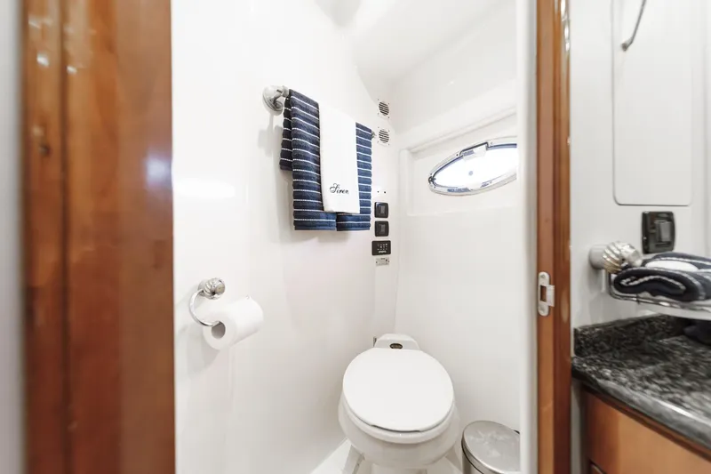  Yacht Photos Pics Bathroom interior of 2003 Carver 570 Voyager Pilothouse yacht, featuring modern amenities.