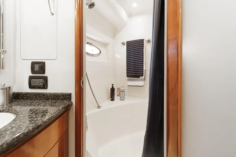  Yacht Photos Pics Luxurious bathroom in 2003 Carver 570 Voyager Pilothouse yacht with granite countertop.