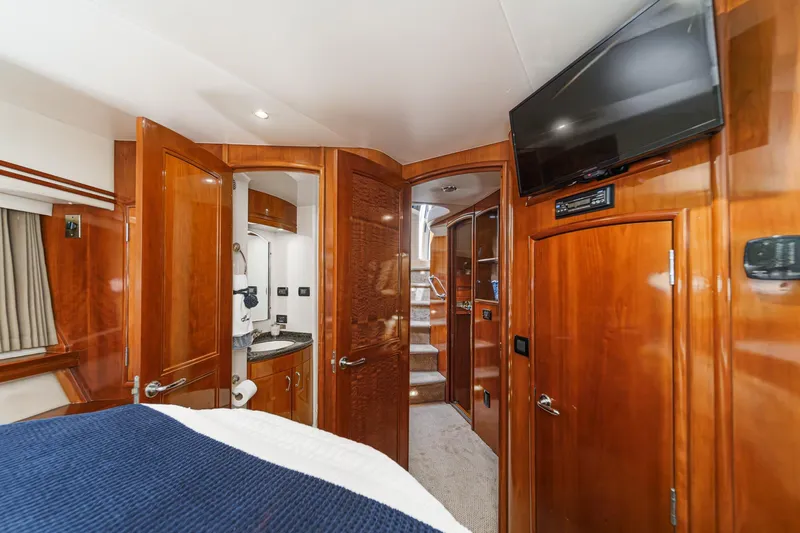  Yacht Photos Pics Luxurious interior of 2003 Carver 570 Voyager Pilothouse with wood finishes and modern amenities.