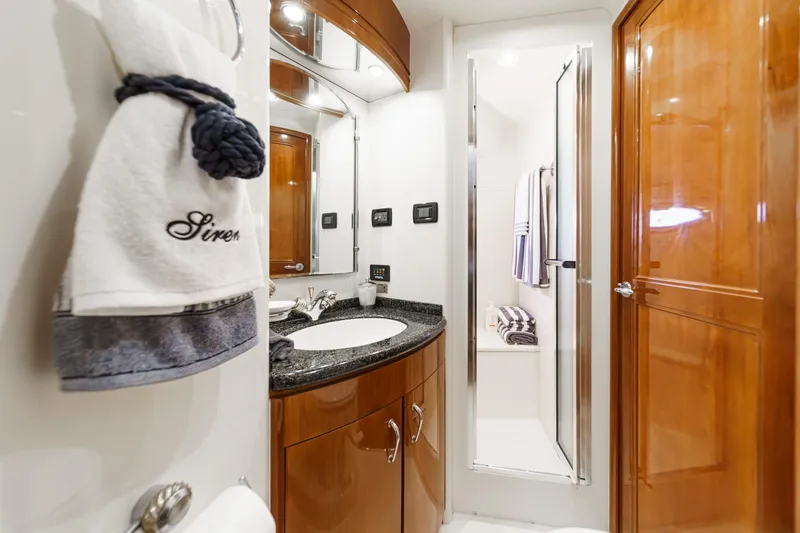  Yacht Photos Pics Luxurious bathroom in 2003 Carver 570 Voyager Pilothouse yacht with elegant wood finishes.