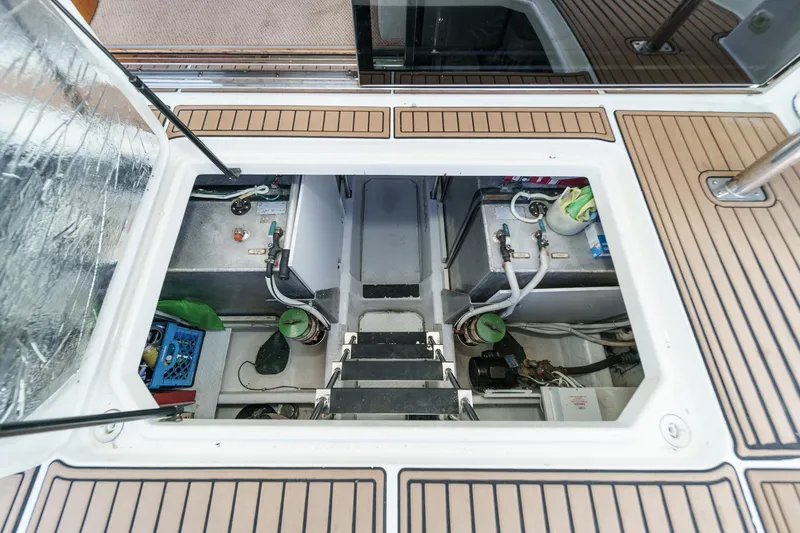  Yacht Photos Pics Engine compartment of 2003 Carver 570 Voyager Pilothouse with visible mechanical components.