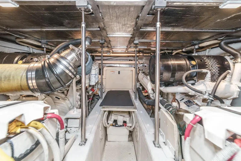  Yacht Photos Pics Engine room of 2003 Carver 570 Voyager Pilothouse, showcasing mechanical components and systems.