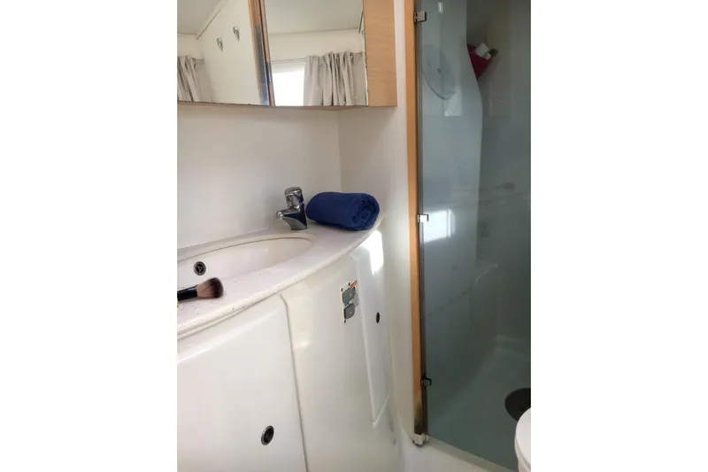 Rewind Yacht Photos Pics Bathroom interior of 2007 Lagoon 440 yacht with sink and shower.