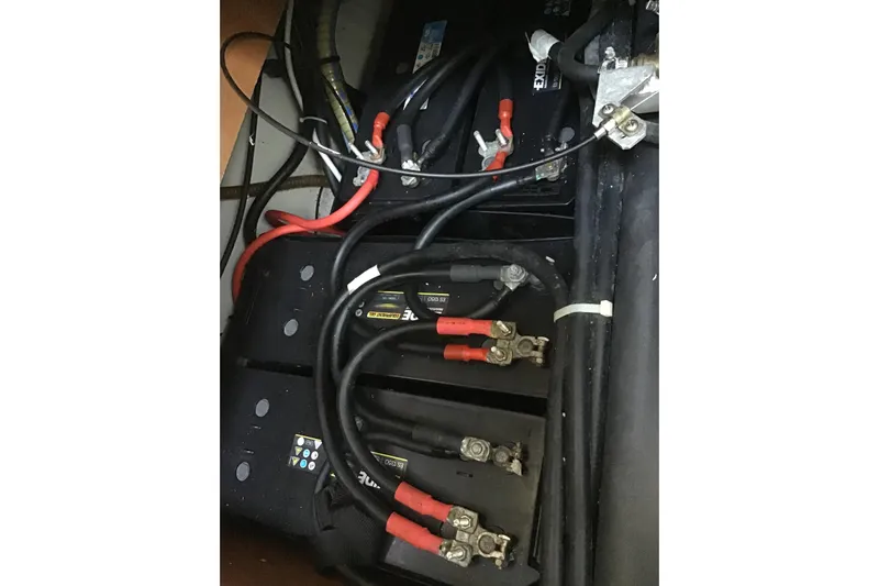 Rewind Yacht Photos Pics Battery compartment of a 2007 Lagoon 440 catamaran with connected cables.