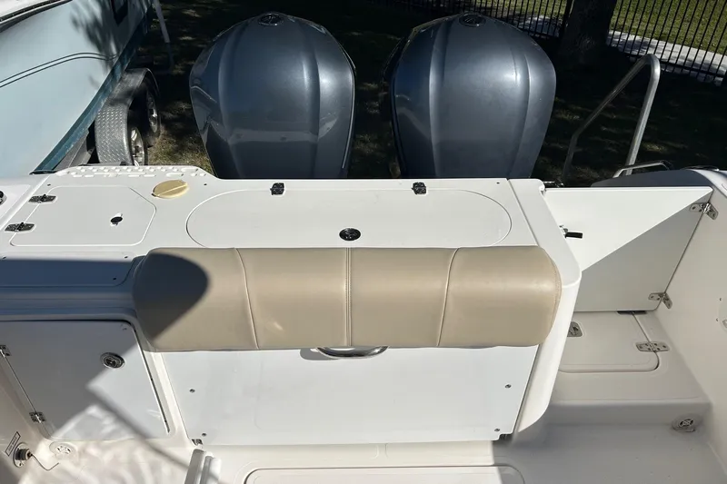  Yacht Photos Pics 2015 Pursuit C 280 Center Console boat with dual engines and beige seating.