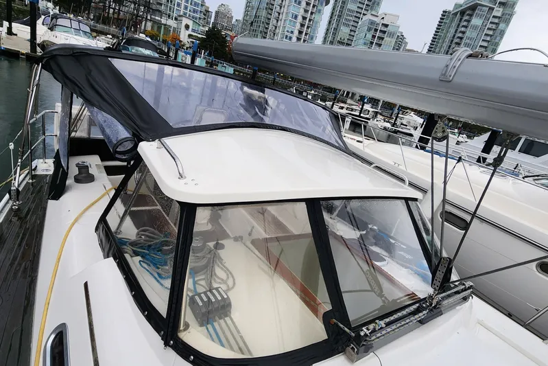 Danza Yacht Photos Pics 2007 Hanse 400e sailboat docked in marina, surrounded by modern buildings.