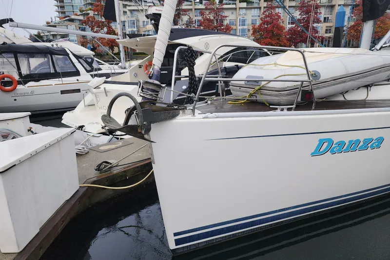 Danza Yacht Photos Pics 2007 Hanse 400e sailboat named Danza docked at marina with other boats.