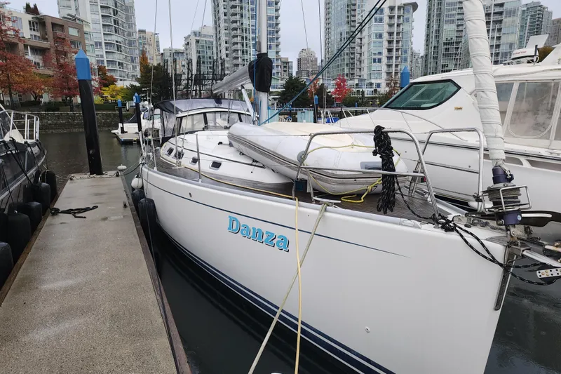 Danza Yacht Photos Pics 2007 Hanse 400e sailboat docked in urban marina with cityscape background.