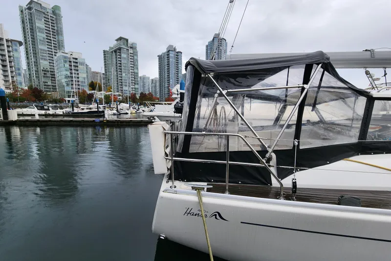 Danza Yacht Photos Pics 2007 Hanse 400e yacht docked in urban marina with city skyline backdrop.