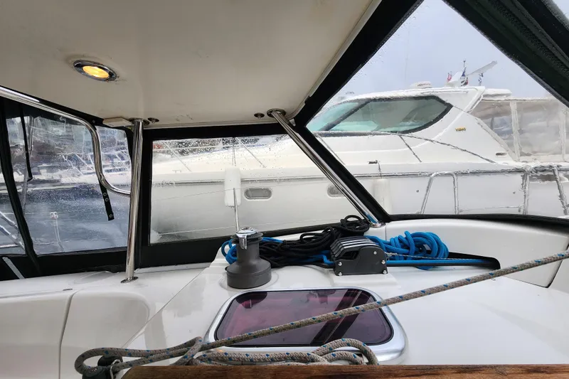 Danza Yacht Photos Pics Interior view of a 2007 Hanse 400e sailboat with marina backdrop.