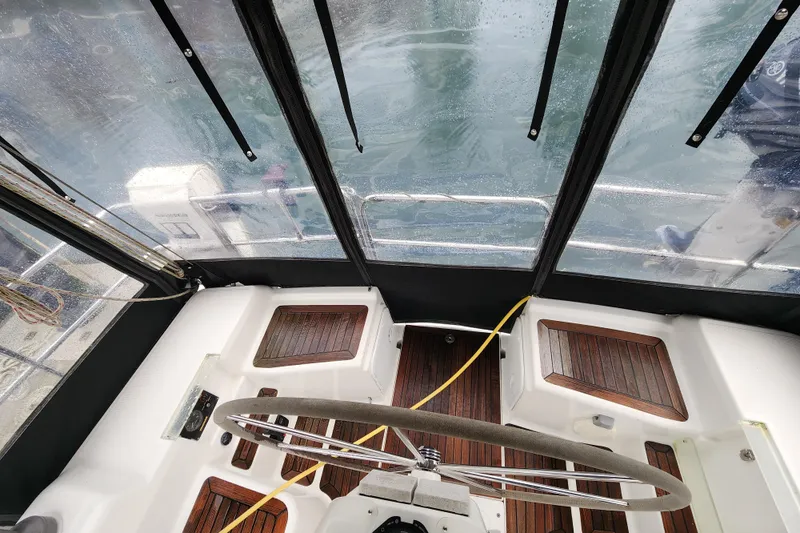 Danza Yacht Photos Pics Cockpit view of 2007 Hanse 400e sailboat with wet deck and steering wheel.