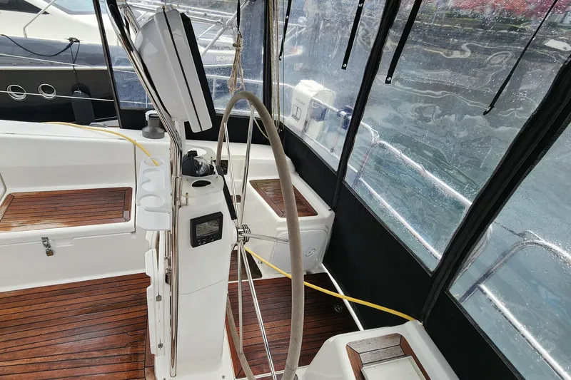 Danza Yacht Photos Pics Cockpit of 2007 Hanse 400e sailboat with wooden flooring and steering wheel.