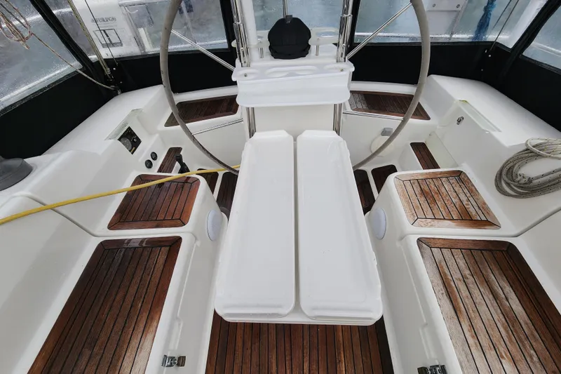 Danza Yacht Photos Pics Cockpit of 2007 Hanse 400e sailboat with wooden flooring and steering wheel.