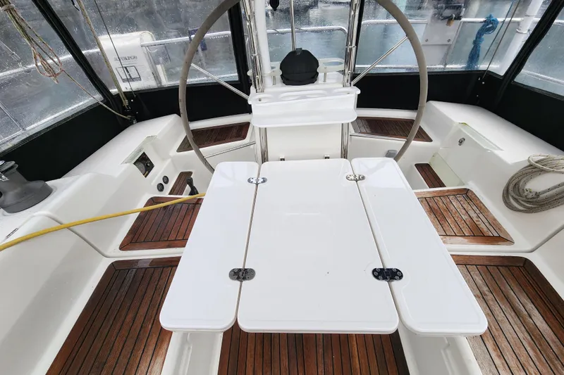 Danza Yacht Photos Pics Cockpit of 2007 Hanse 400e sailboat with wooden flooring and steering wheel.