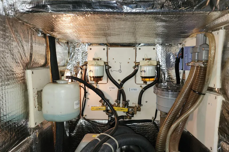 Danza Yacht Photos Pics Engine compartment of a 2007 Hanse 400e yacht, featuring fuel filters and hoses.