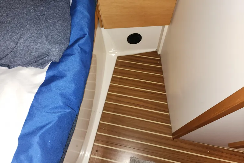 Danza Yacht Photos Pics Interior of 2007 Hanse 400e yacht with wooden flooring and blue bedding.