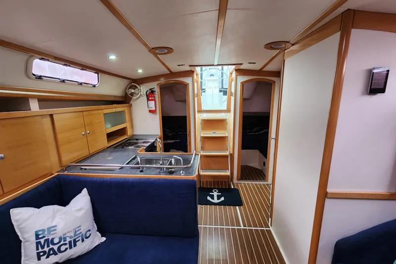 Danza Yacht Photos Pics Interior of 2007 Hanse 400e yacht with modern wood finish and cozy seating.