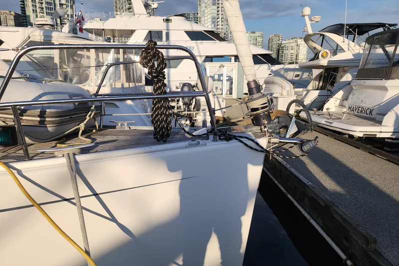 Danza Yacht Photos Pics 2007 Hanse 400e yacht docked at marina, surrounded by other boats.