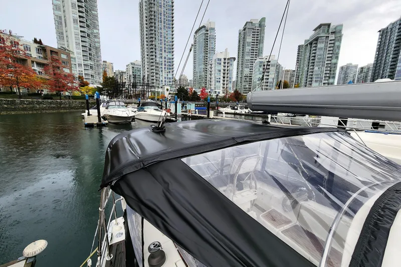 Danza Yacht Photos Pics 2007 Hanse 400e sailboat docked in urban marina with skyscrapers in background.