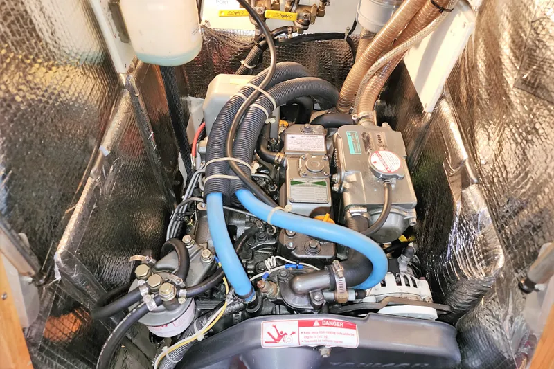 Danza Yacht Photos Pics Engine compartment of a 2007 Hanse 400e sailboat, featuring various hoses and components.