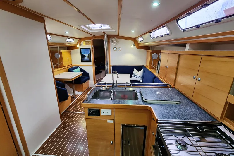 Danza Yacht Photos Pics Interior of 2007 Hanse 400e yacht with modern kitchen and cozy seating area.