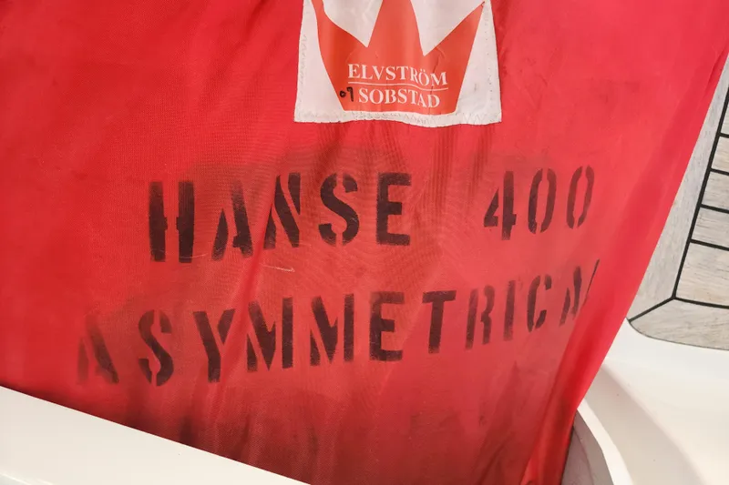 Danza Yacht Photos Pics Red sail with "Hanse 400 Asymmetric" text, Elvstr&oslash;m Sobstad logo, 2007 model.