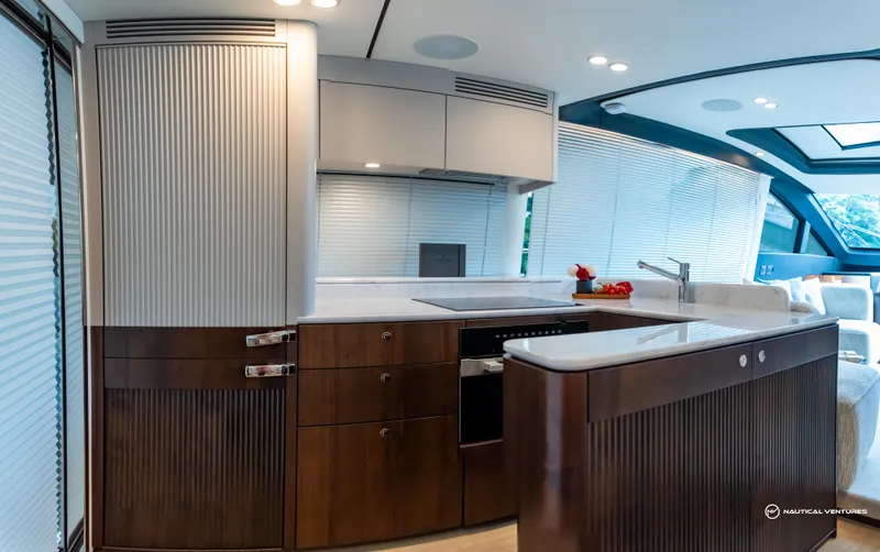 Fairline Phantom Yacht Photos Pics Luxurious 2023 Fairline Phantom 65 yacht kitchen with modern design and sleek cabinetry.