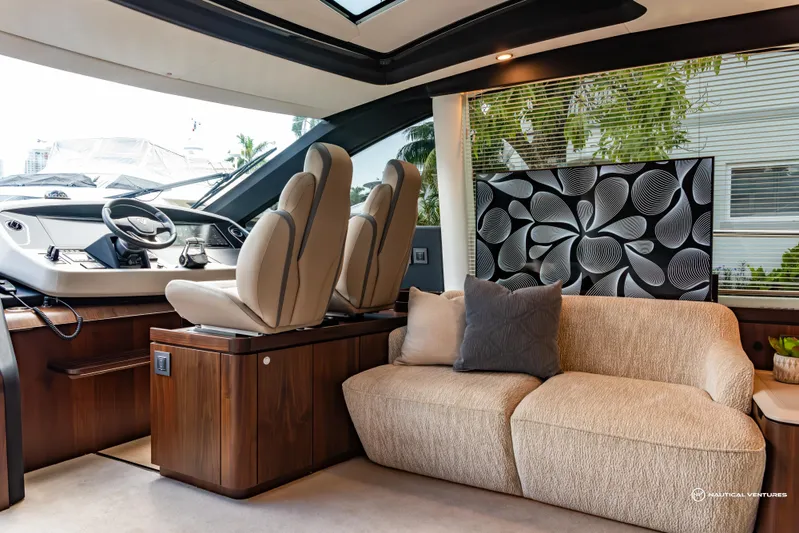 Fairline Phantom Yacht Photos Pics Luxurious interior of 2023 Fairline Phantom 65 yacht with plush seating and modern design.