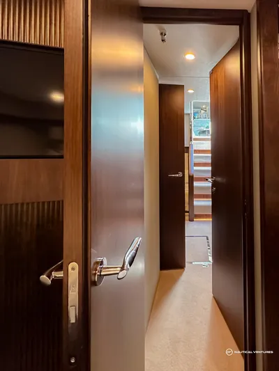 Fairline Phantom Yacht Photos Pics Interior view of 2023 Fairline Phantom 65 yacht, featuring elegant wooden doors and modern design.