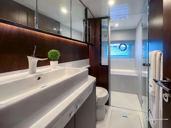 Fairline Phantom Yacht Photos Pics Luxurious bathroom in 2023 Fairline Phantom 65 yacht, featuring modern fixtures and elegant design.
