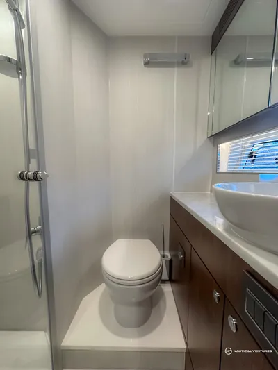 Fairline Phantom Yacht Photos Pics 2023 Fairline Phantom 65 yacht bathroom with modern fixtures and sleek design.