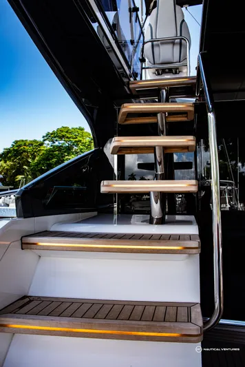 Fairline Phantom Yacht Photos Pics Staircase on 2023 Fairline Phantom 65 yacht with sleek design and wooden steps.