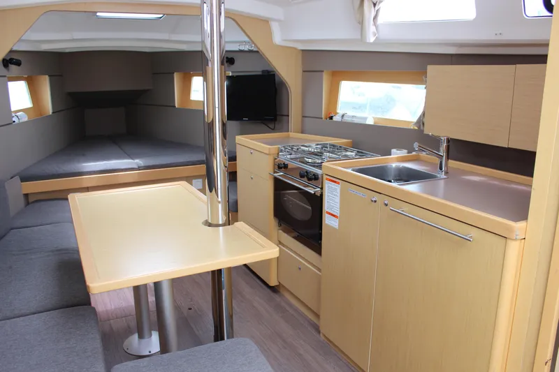 Silver Lining Yacht Photos Pics Interior of 2015 Beneteau Oceanis 35 yacht with modern kitchen and dining area.
