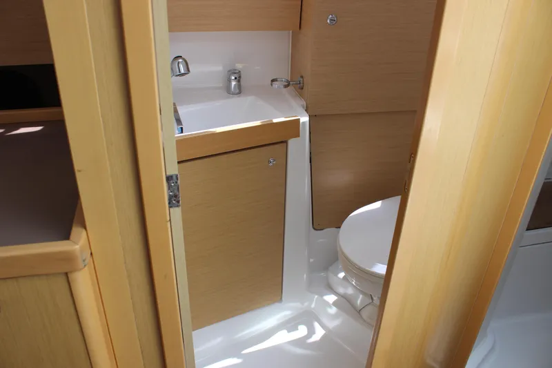 Silver Lining Yacht Photos Pics Interior of 2015 Beneteau Oceanis 35 with bathroom and toilet.