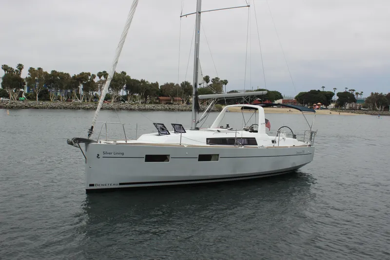 Silver Lining Yacht Photos Pics 2015 Beneteau Oceanis 35 sailboat on calm water.