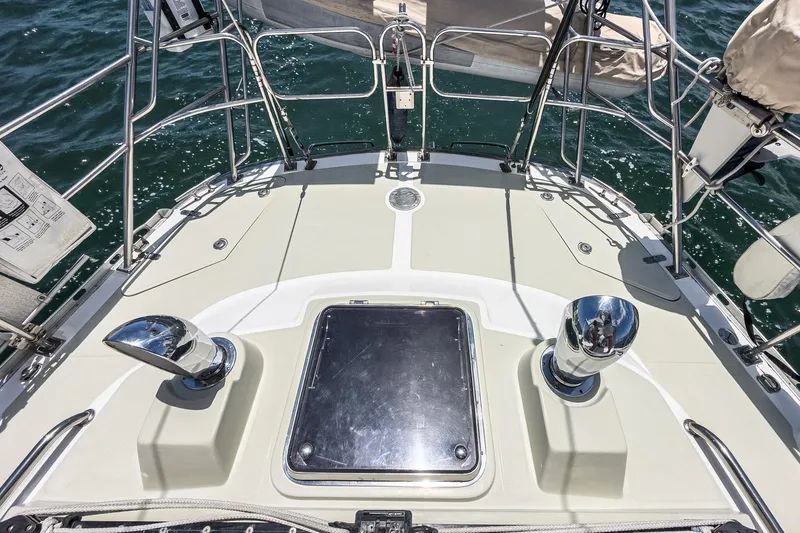 Dea Latis Yacht Photos Pics Deck of 2001 Hylas 49 sailboat with chrome fittings and ocean view.