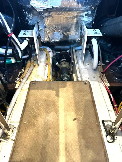 Miracles Yacht Photos Pics Engine room of 2006 Carver 41 Cockpit Motor Yacht, showing mechanical components and wiring.