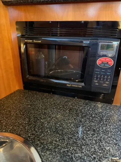 Miracles Yacht Photos Pics Sharp Carousel microwave in 2006 Carver 41 Cockpit Motor Yacht kitchen.