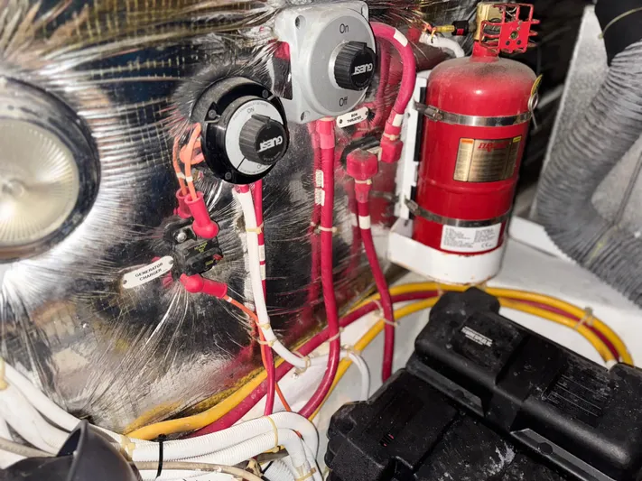 Miracles Yacht Photos Pics Engine room of 2006 Carver 41 Cockpit Motor Yacht with wiring and fire extinguisher.