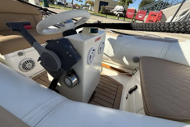 M/y Kosmos II Yacht Photos Pics Interior view of a 2006 Ferretti 530 yacht, featuring steering controls and seating.