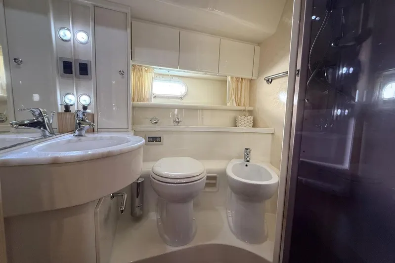 M/y Kosmos II Yacht Photos Pics Luxurious bathroom in 2006 Ferretti 530 yacht with modern fixtures and elegant design.