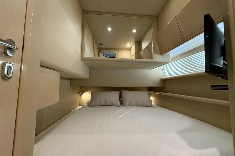 M/y Kosmos II Yacht Photos Pics Luxurious cabin interior of 2006 Ferretti 530 yacht with modern amenities.