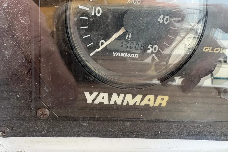 First Admiral Yacht Photos Pics Close-up of a Yanmar engine gauge on a 2006 Hunter 38 sailboat.