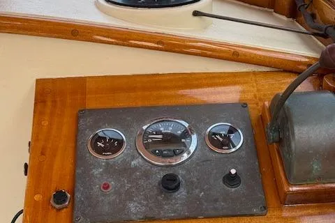 Ilona Yacht Photos Pics Control panel of a 2005 Custom Gannon & Benjamin boat with wooden finish.