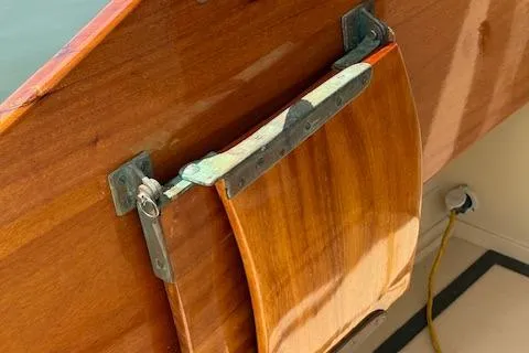 Ilona Yacht Photos Pics Wooden rudder of a 2005 Custom Gannon & Benjamin boat with metal fittings.