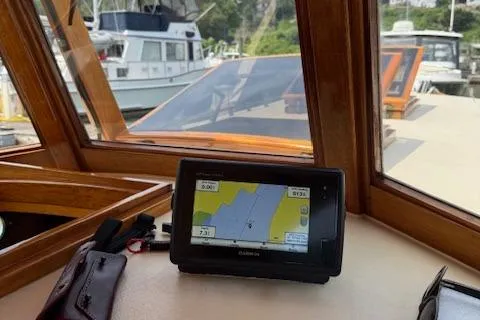 Ilona Yacht Photos Pics Boat cockpit with navigation system, Custom Gannon & Benjamin model, 2005, docked at marina.
