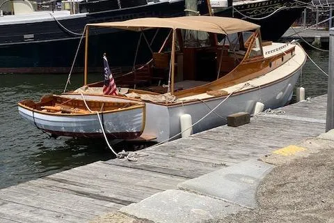 Ilona Yacht Photos Pics Custom 2005 Gannon & Benjamin boat docked, featuring wooden design and American flag.